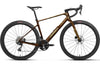 A side-profile view of an Orbea gravel bicycle with a metallic bronze-brown frame, black drop handlebars, black tires, and a black saddle, set against a plain white background.